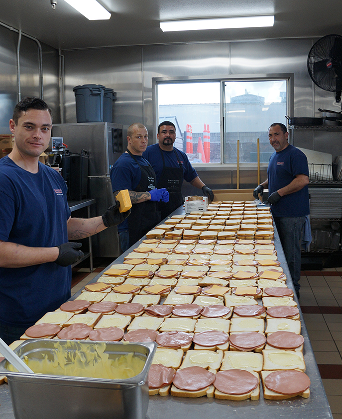 Rescue Mission Volunteers Making Sandwiches