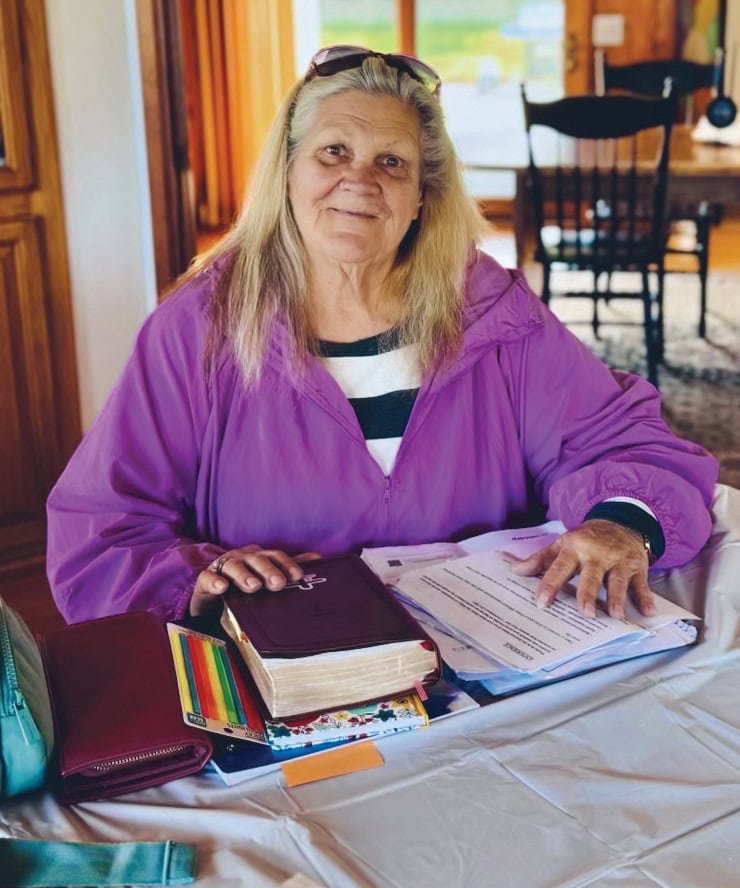 Helping woman at Rescue Mission Alliance Ventura County with paperwork and support.