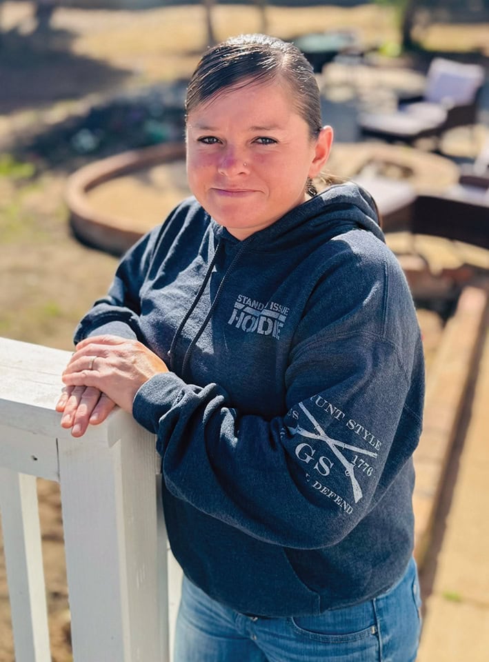 Young girl outdoors at Rescue Mission Ventura County, smiling confidently.